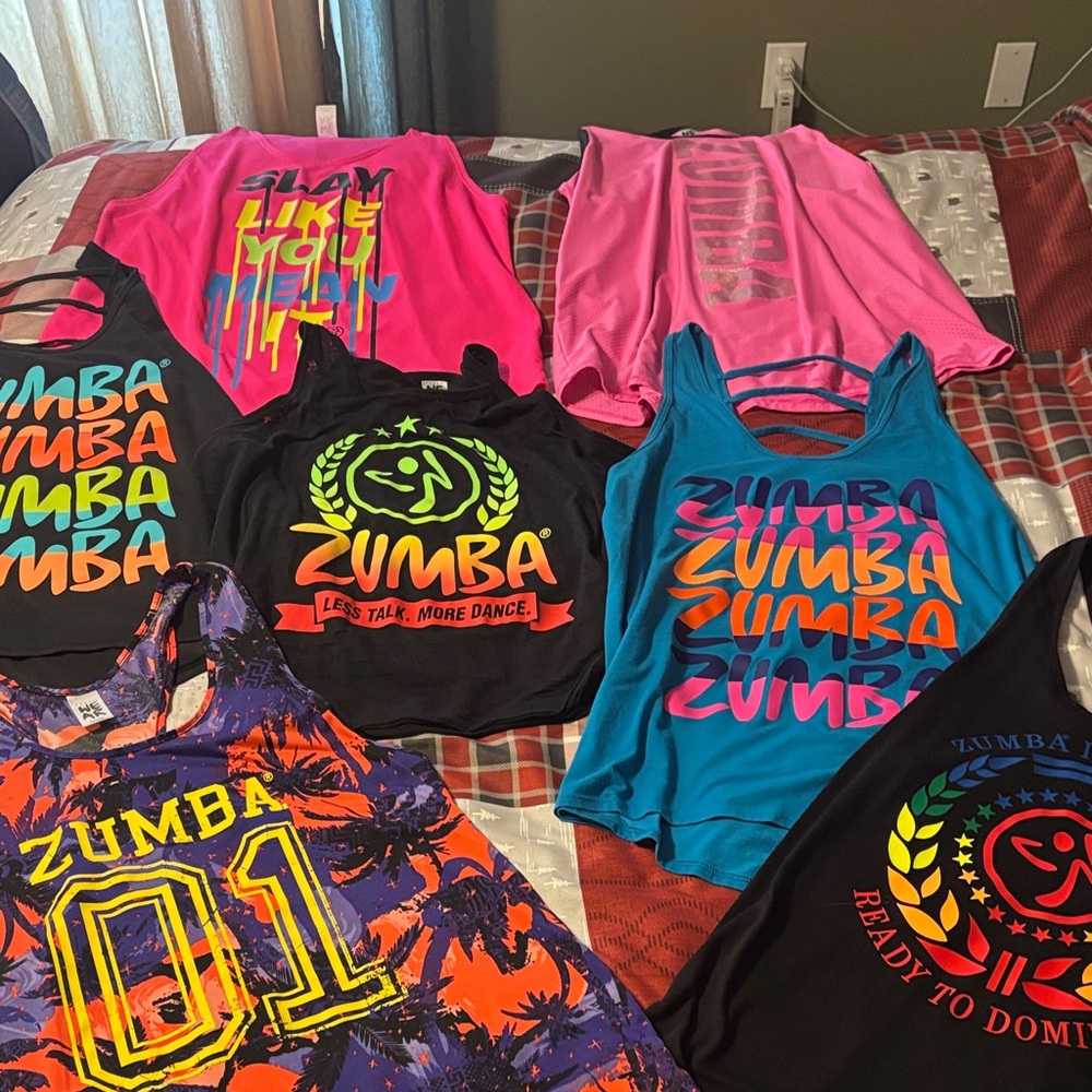 Lot of 7 Zumba Fitness Colorful Tank Tops Collection great condition. Size Large